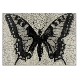 Planche À Découper Papillon noir et blanc sur l'arrière - plan criqué
