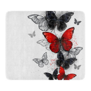 Planche À Découper Papillons noirs et rouges volants