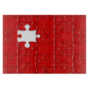 planche à découper rouge de puzzle