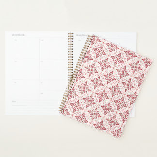 Planificateur en spirale avec design rouge et rose