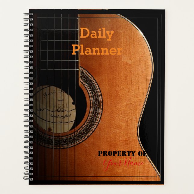 Planificateur quotidien avec une guitare sur la co (Devant)