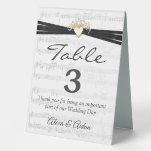 Plaque De Table Coeur d'or avec ruban sur feuille de musique