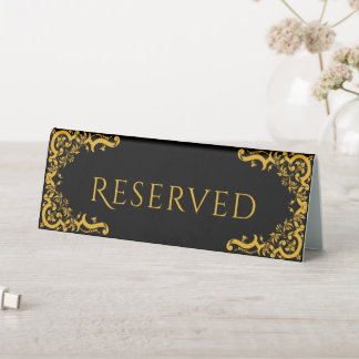 Plaque De Table Noir et or avec éléments décoratifs