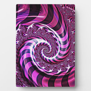 Plaque d'illusion de spirale rose et noire