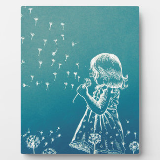 Plaque Photo Petite fille qui souffle sur un pissenlit