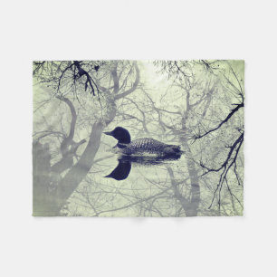 Polaire Dingue noir et blanc sur une couverture de jet de