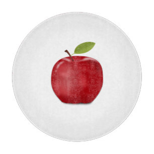 Pomme rouge sur planche à découper blanche