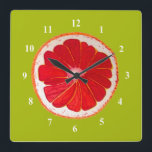 Pop Art Pink Grapefruit Art Original Aquarell Quadratische Wanduhr<br><div class="desc">Eine niedliche und farbenfrohe rosa Grapefruitscheibe aus einem Originalgemälde des Künstlers Sacha Grossel. Dieses große Fruchtstück im Pop ist rosa und sehr hell und farbenfroh,  vor einem farbenfrohen Hintergrund mit Kalkgrün. Quirkisch und originell.</div>