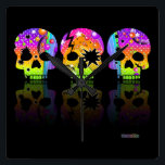 Pop Art SKULLS WALL CLOCK Quadratische Wanduhr<br><div class="desc">Farbenfroher Pop Kunst menschliche Schädel. Beängstigend und gleichzeitig optimistisch - sorta Goth trifft die Sechziger. Halloween wird nie mehr das Gleiche sein und es ist ein perfektes Design für den Tag der Toten!</div>
