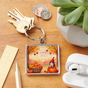 Porte-clés Action de grâce, jolie petite fille et citrouilles