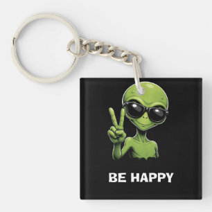 Porte-clés Alien mignon avec deux doigts levés