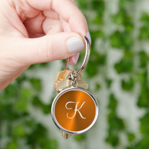 Porte-clés Bronze brillant faux monogramme métallique