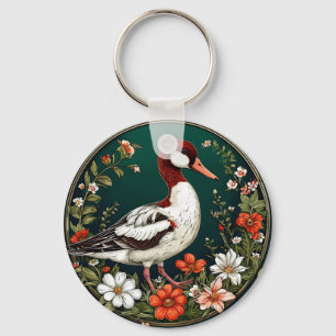Porte-clés Canard élégant entouré de fleurs vibrantes