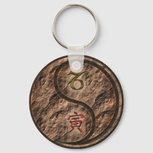 Porte-clés Capricorne et Tigre de la Terre