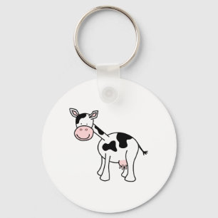 Porte-clés Caricature de vache noire et blanche.