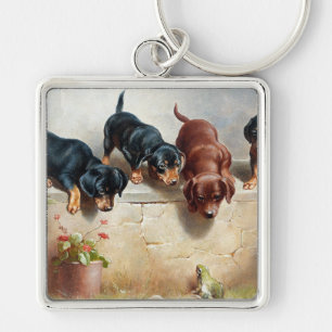Porte-clés Carl Reichert Curious Dachshund Puppies et une gre