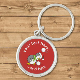 Porte-clés Christmas Penguin Getting a Snow Ball Keychain