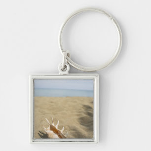 Porte-clés Coquillage sur la plage sablonneuse