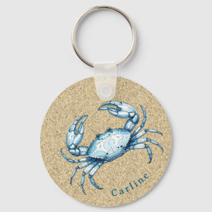 Porte-clés Crabe bleu sur fond sablonneux