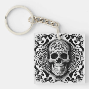 Porte-clés Crâne de dentelle souriante noir et blanc