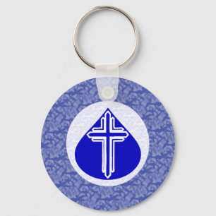 Porte-clés Croix blanche dans une larme bleue Fond bleu