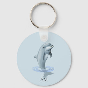 Porte-clés Dauphin et monogramme sur fond bleu clair