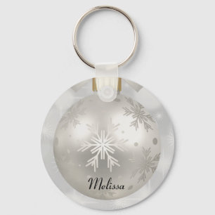 Porte-clés Élégante boule de Noël en argent sur les lumières 