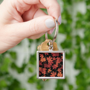Porte-clés Feuilles de l'érable d'automne rouge sur fond noir