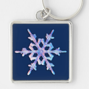 Porte-clés Flacon de neige Iridescente sur bleu foncé
