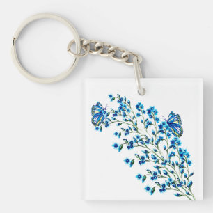 Porte-clés Fleurs bleues délicates avec papillon