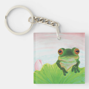 Porte-clés Grenouille verte derrière le porte - clé du tapis