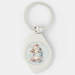Porte-clés Hibou endormi dans des tasses à thé florales empil