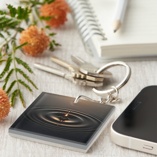 Porte-clés Impact doré sur la surface viscale (Devant Droit)