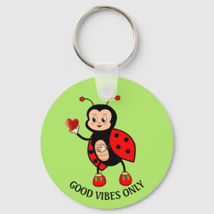 Porte-clés Jolie coccinelle et cœur sur fond vert
