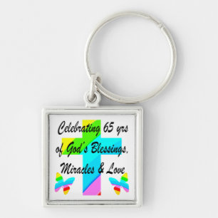 PORTE-CLÉS JOLIE RAINBOW CROSS 65E ANNIVERSAIRE CONCEPTION