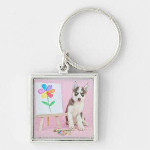 Porte-clés Le marionnettiste Husky Peint une fleur arc-en-cie