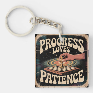 Porte-clés Le progrès aime la patience