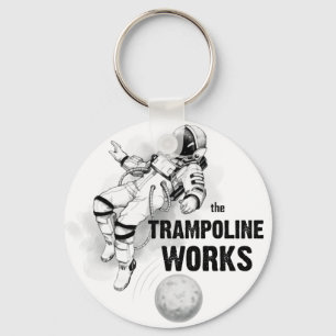Porte-clés Le Trampoline travaille l'astronaute noir et blanc