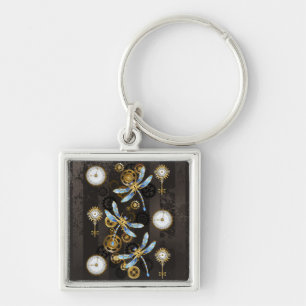 Porte-clés Libellules Steampunk sur fond rayé marron