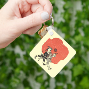 Porte-clés Merveilleux Magicien d'Oz, Dorothy avec des fleurs