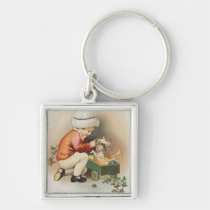 Porte-clés Mon voeu de Noël Enfant observant les jouets