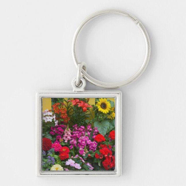 Porte-clés Palissade jaune avec jardin fleuri dans (Devant)