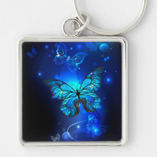 Porte-clés Papillon Morpho sur fond sombre