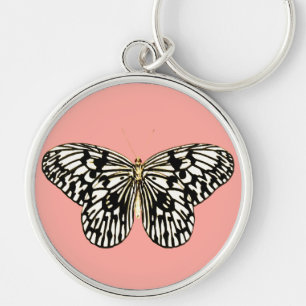 Porte-clés Papillon noir et blanc, arrière - plan corail rose