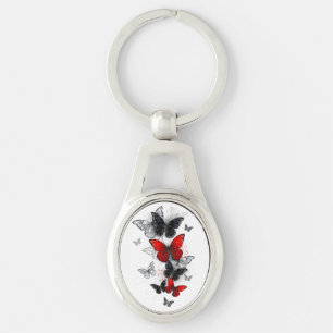 Porte-clés Papillons noirs et rouges volants