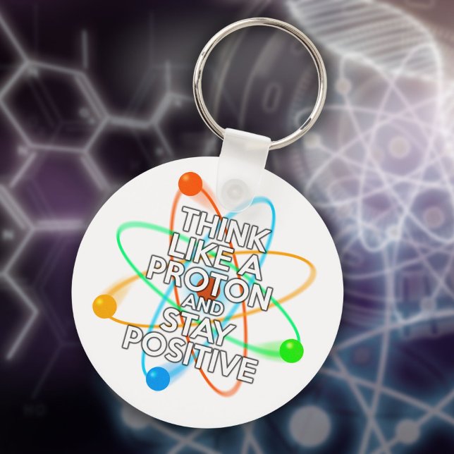 PORTE-CLÉS PENSEZ À UN PROTON ET RESTEZ POSITIF (THINK LIKE A PROTON AND STAY POSITIVE KEYCHAIN)