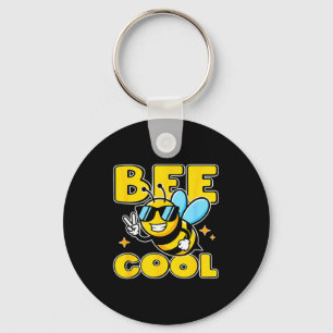 Porte-clés Personnage d'abeille heureuse signe de paix amusan