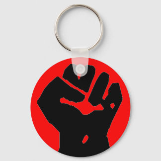 Porte-clés poing noir sur porte - clé rouge
