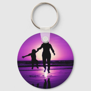 Porte-clés Sauter de plage d'enfant de mère et de fils