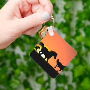 Porte-clés Silhouette de chevaux sauvages au coucher du solei